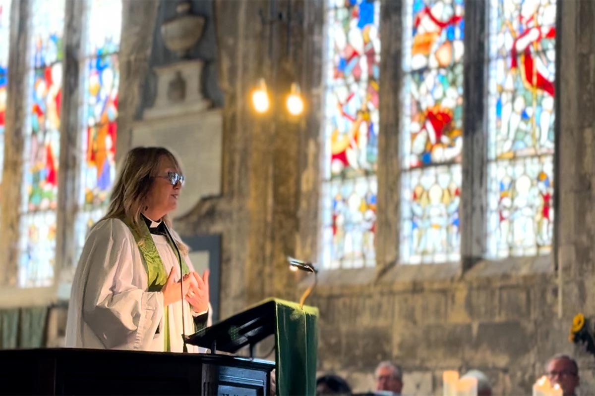 Everyone pitches in to make the burgers and bbq for the back-to-school Pentecost BBQ