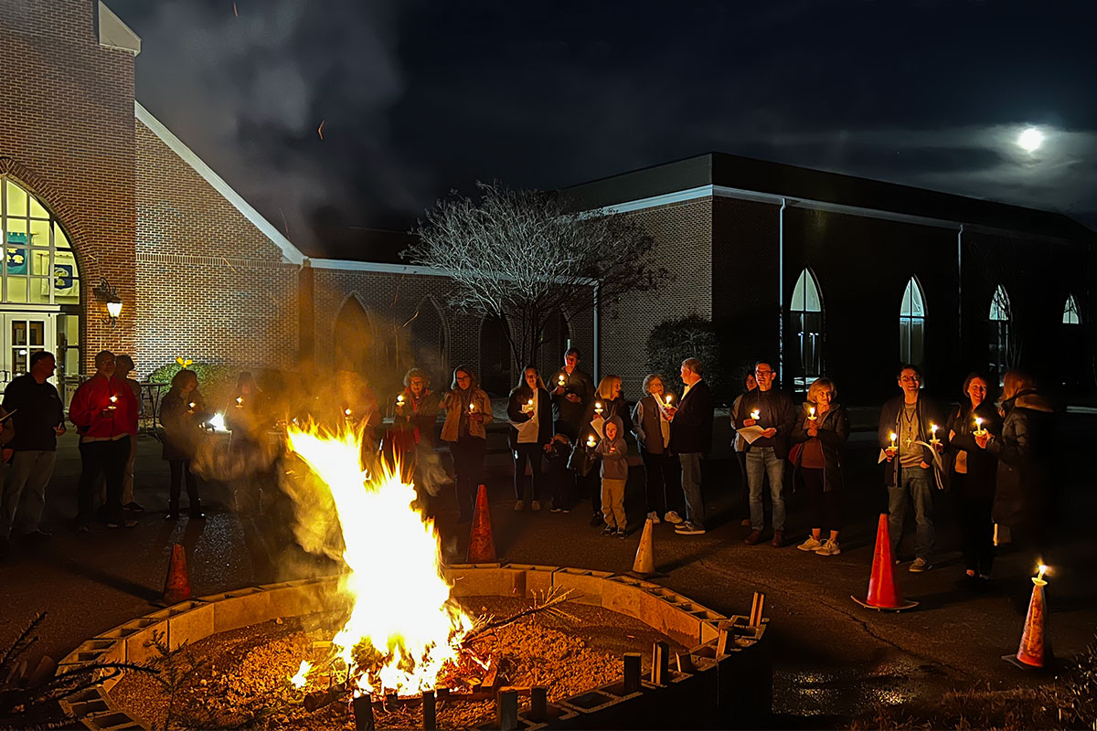 Rev. Lisa administering ashes to a woman in her car